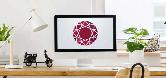 Jewelry Business Forum logo on desktop computer on desk