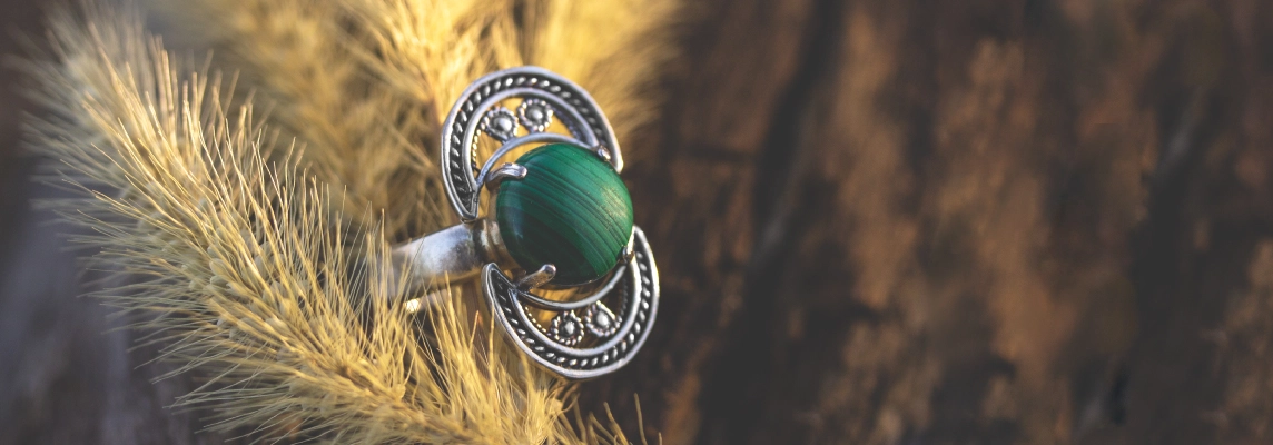 Sterling silver statement ring featuring a green malachite stone