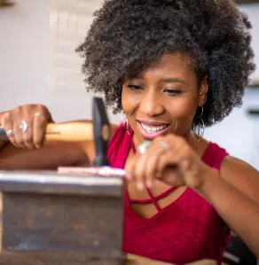 Metalsmith working at jewelers bench