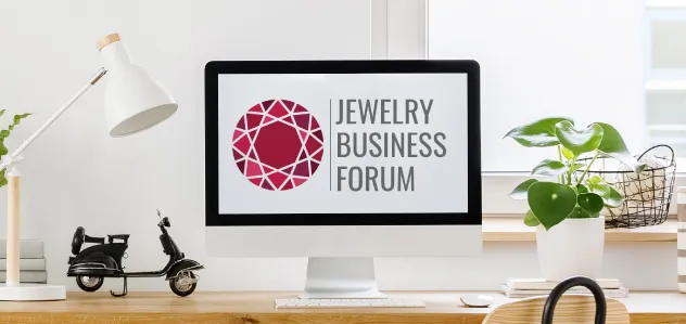 Jewelry Business Forum logo on desktop computer